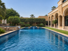 Luxury Outdoor Swimming Pool with Blue Mosaic Tiles & Waterfall