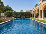 Luxury Outdoor Swimming Pool with Blue Mosaic Tiles & Waterfall