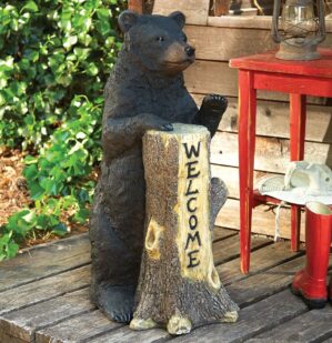rustic bear tree-trunk welcome sign on porch entrance