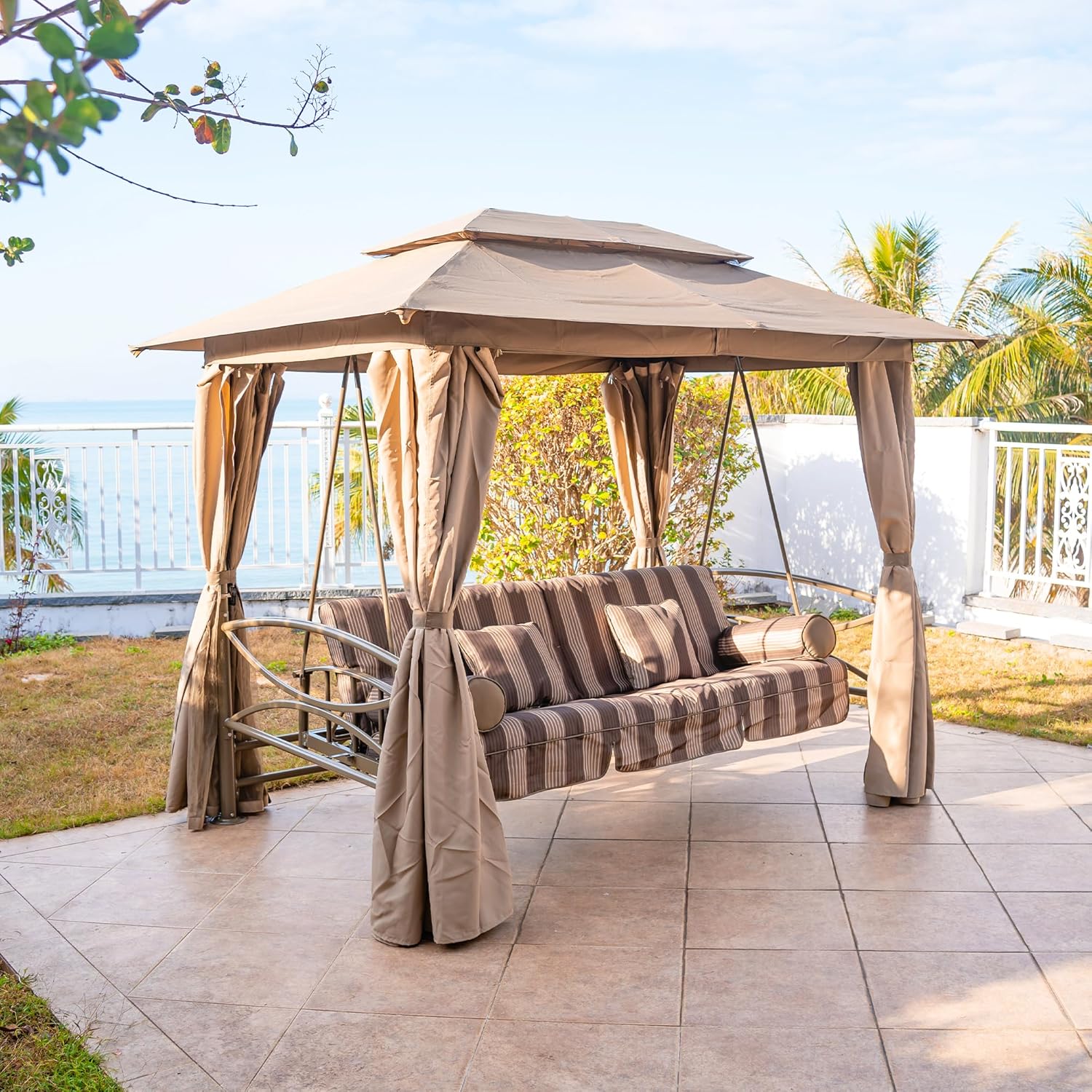 patio furniture arrangement with purple-leaf porch swing and garden lawn